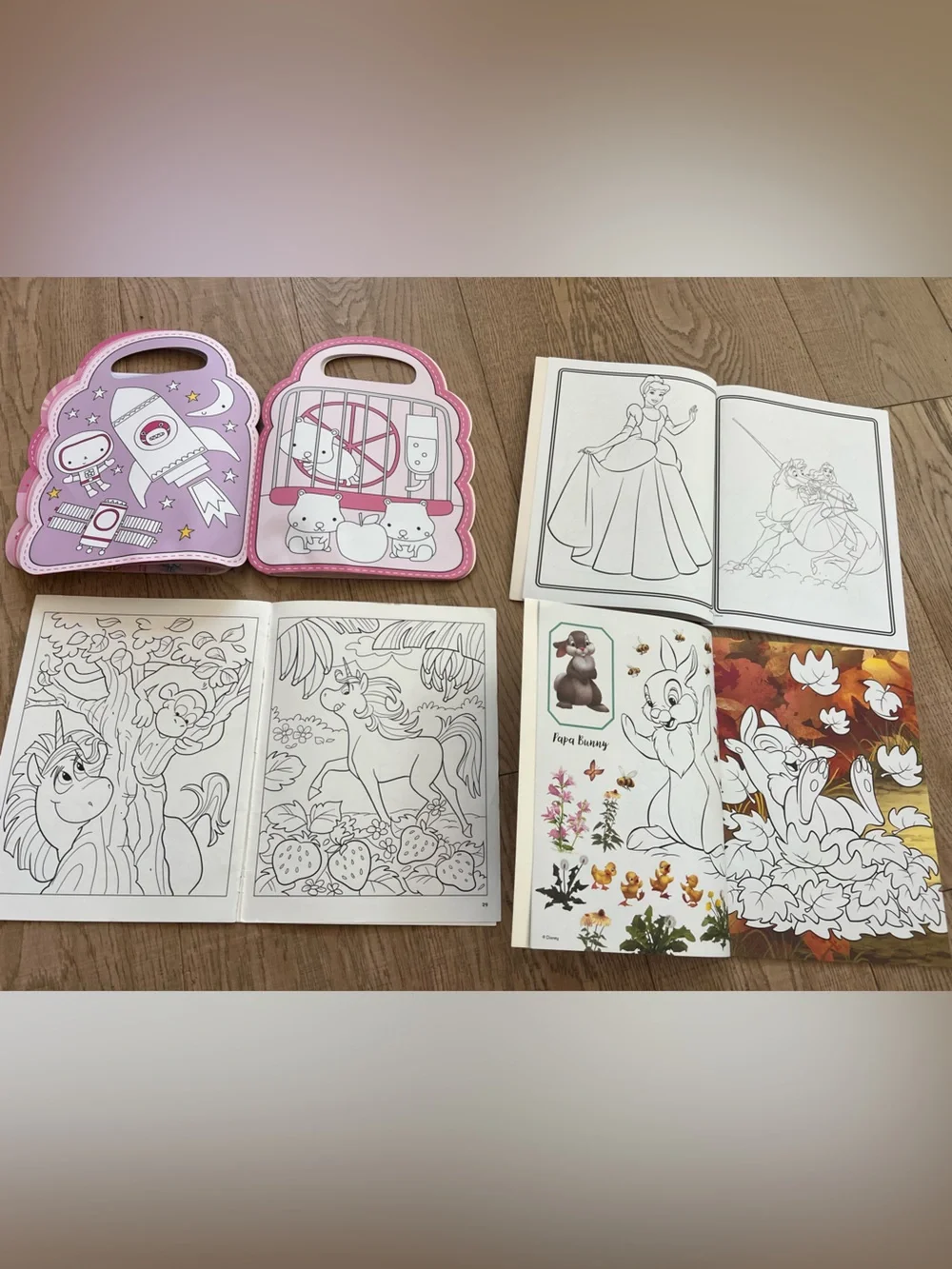 4 coloring books - 2 x Disney, 1 x Unicorns, 1 x Pink Purse.